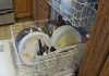 Engineer rearranges contents of dishwasher to optimize dirty dish density