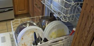 Engineer rearranges contents of dishwasher to optimize dirty dish density