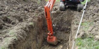 Consultant proposes digging holes on well leases to bury dirt