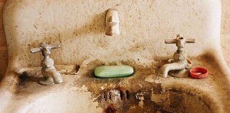 Public Health Service SWAT Team Raids Bigass Oil Co. Men’s Room